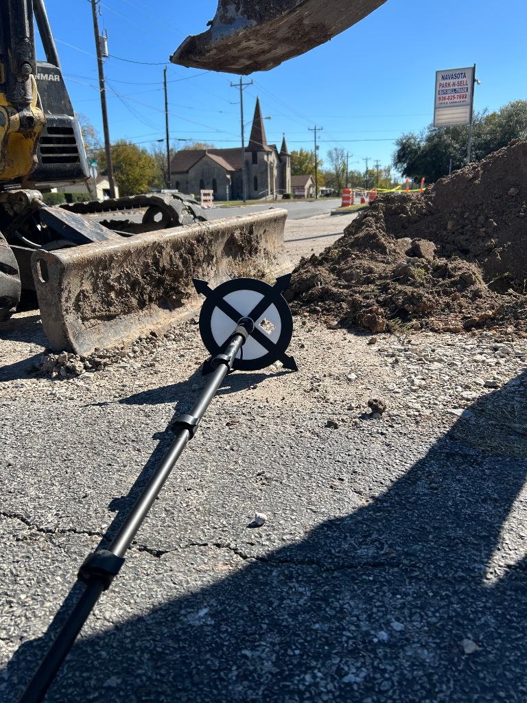 Utility locating crew using GNSS equipment with BumpGuard protection on construction site